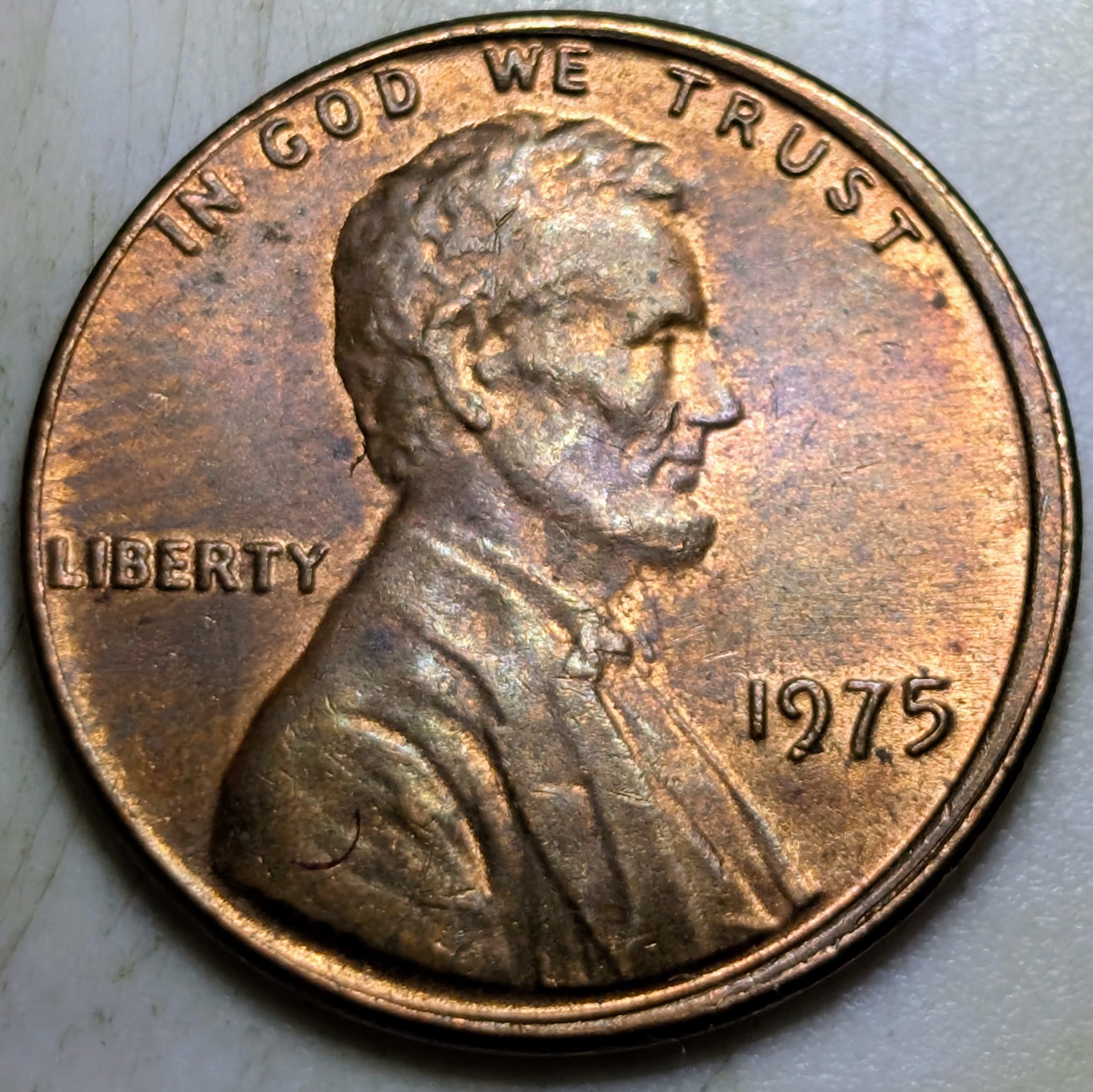1975 Lincoln cent with a noticeable off center strike, leaving part of the design shifted toward the rim.