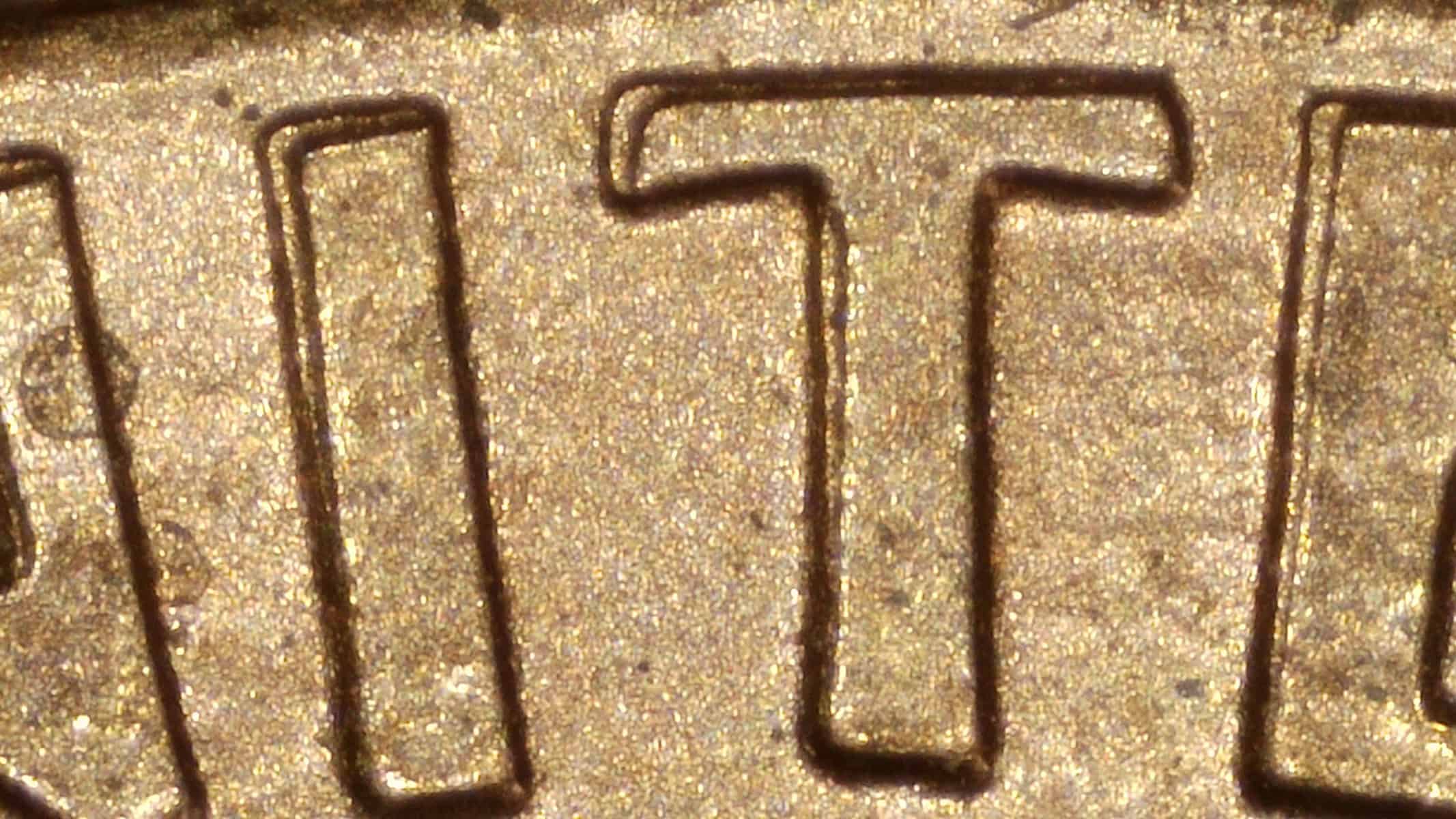Close-up of machine doubling on UNITED lettering of a 1995 Lincoln cent